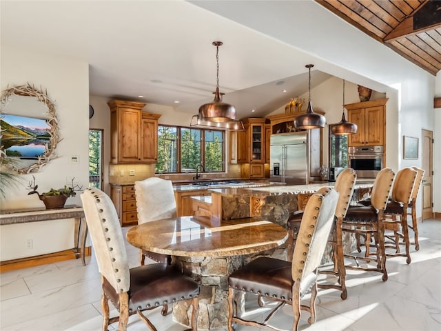 59 Mountain Bluebell Rd, Keystone, CO 80435 - dining room with light marble finish flooring, lofted ceiling, recessed lighting, and baseboards