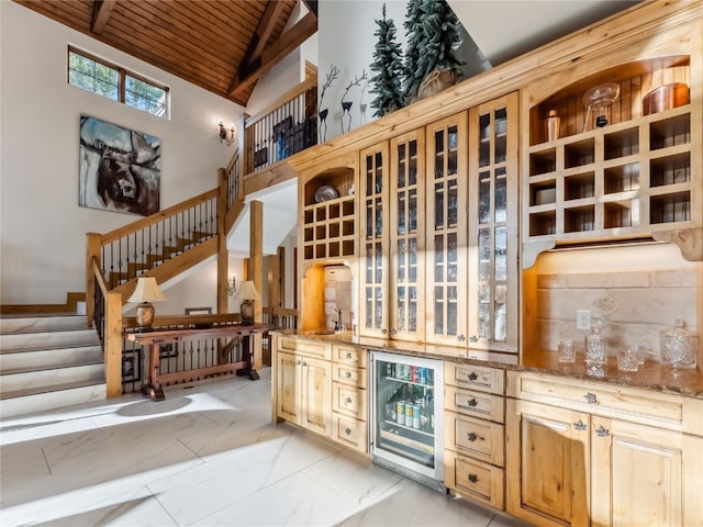59 Mountain Bluebell Rd, Keystone, CO 80435 - indoor bar with wood ceiling, wine cooler, stairway, and high vaulted ceiling