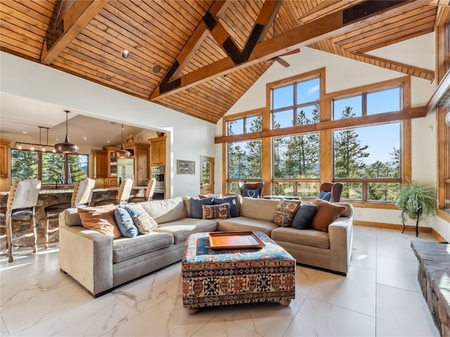 59 Mountain Bluebell Rd, Keystone, CO 80435 - living room with plenty of natural light, wooden ceiling with exposed beams, and high vaulted ceiling