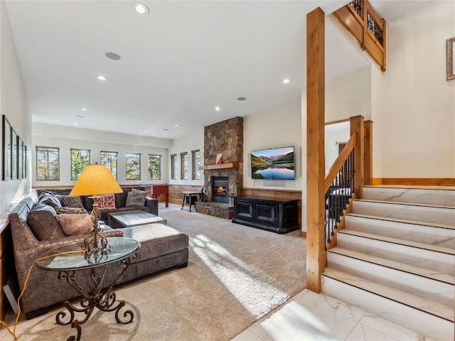 59 Mountain Bluebell Rd, Keystone, CO 80435 - living room featuring recessed lighting, stairs, a stone fireplace, and marble finish flooring