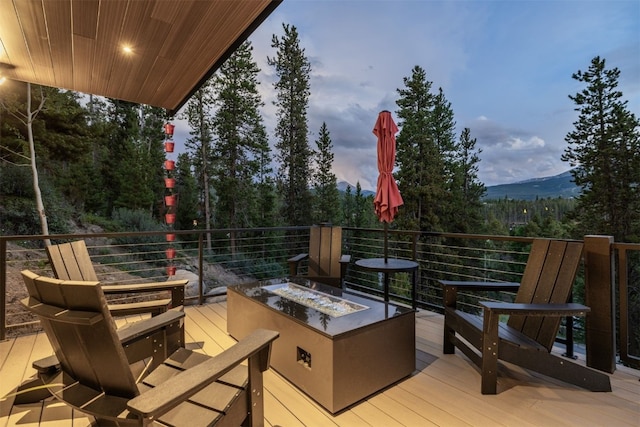 456 Forest Hills Dr, Breckenridge, CO 80424 - wooden terrace with an outdoor fire pit and a mountain view