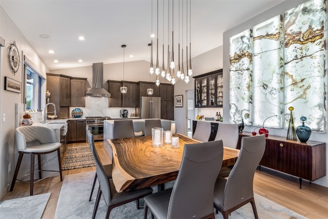 456 Forest Hills Dr, Breckenridge, CO 80424 - dining space featuring light wood finished floors, vaulted ceiling, and recessed lighting