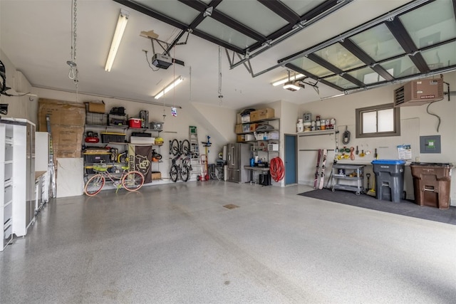 456 Forest Hills Dr, Breckenridge, CO 80424 - garage featuring a garage door opener, a heating unit, and a workshop area