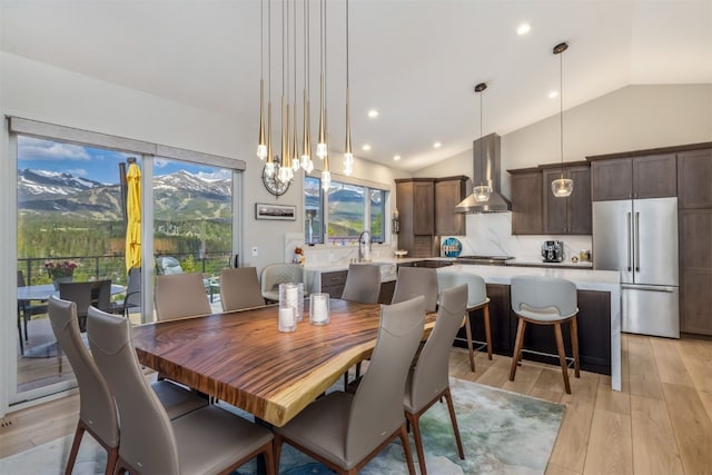 456 Forest Hills Dr, Breckenridge, CO 80424 - dining space with vaulted ceiling, light wood-style floors, plenty of natural light, a chandelier, and recessed lighting