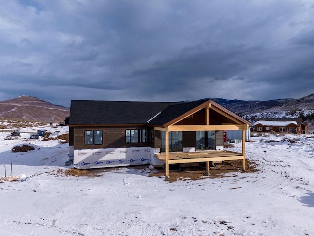 30350 Hostler Dr, Oak Creek, CO 80467 - snow covered rear of property featuring a mountain view