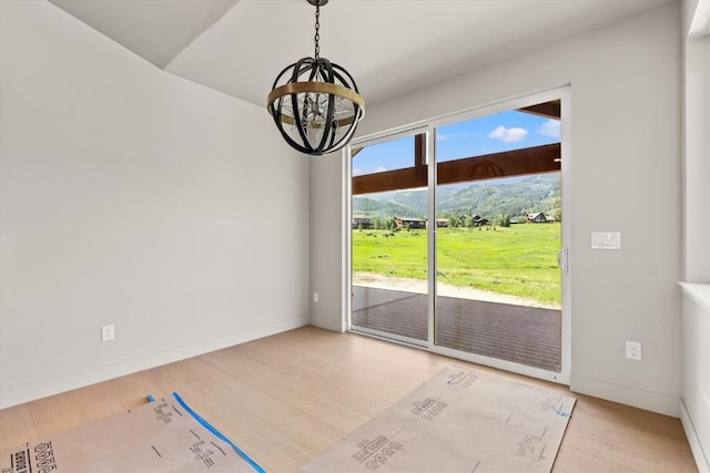 30350 Hostler Dr, Oak Creek, CO 80467 - unfurnished dining area featuring a chandelier and wood finished floors