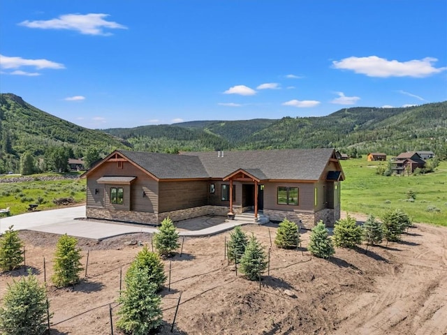 30350 Hostler Dr, Oak Creek, CO 80467 - view of front of home featuring a mountain view and stone siding