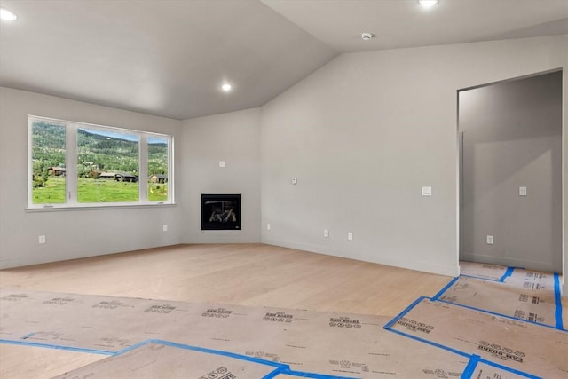 30350 Hostler Dr, Oak Creek, CO 80467 - unfurnished living room featuring lofted ceiling, recessed lighting, wood finished floors, and a glass covered fireplace