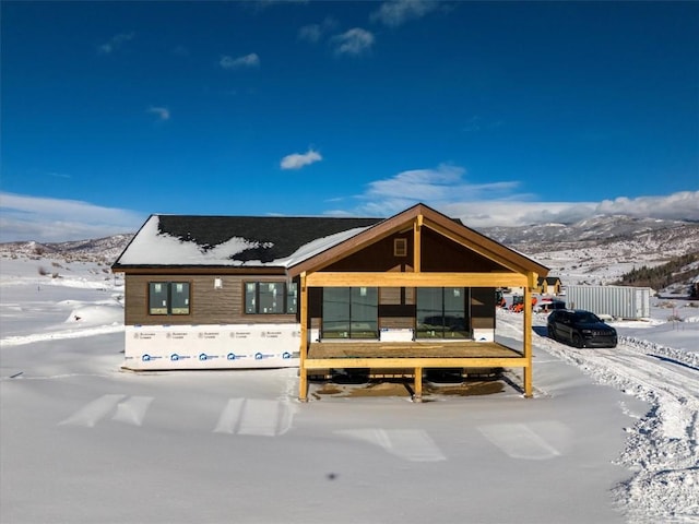 30350 Hostler Dr, Oak Creek, CO 80467 - view of front of home with a mountain view and fence