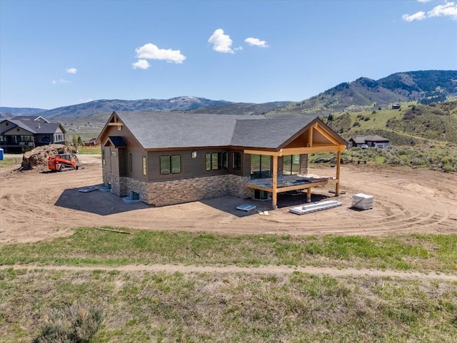 30350 Hostler Dr, Oak Creek, CO 80467 - back of property featuring a mountain view and stone siding