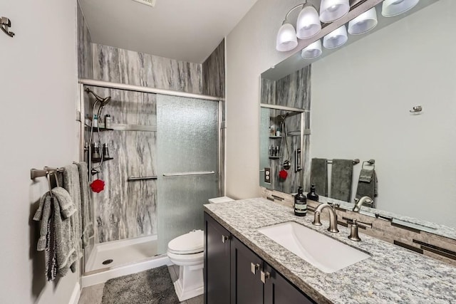 320 Kestrel Ln Unit 320, Silverthorne, CO 80498 - bathroom with toilet, a shower stall, and vanity