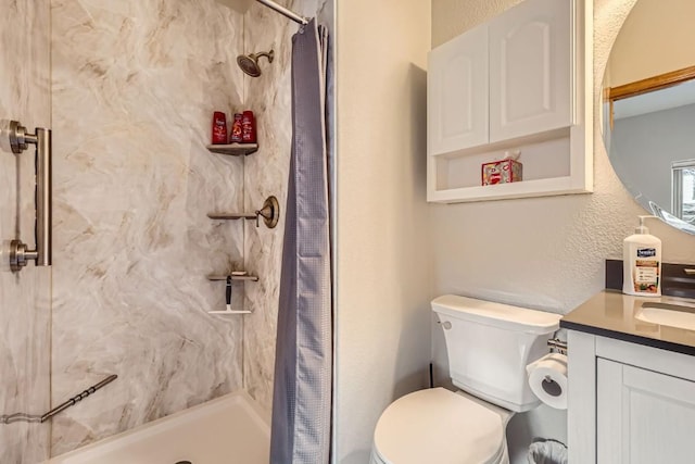 320 Kestrel Ln Unit 320, Silverthorne, CO 80498 - bathroom with a shower stall, toilet, and vanity