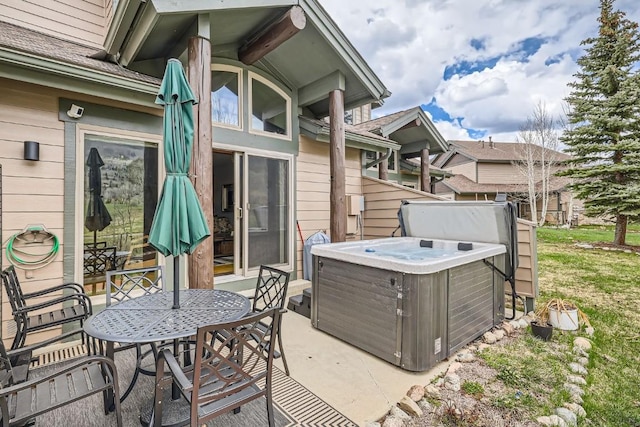 320 Kestrel Ln Unit 320, Silverthorne, CO 80498 - view of patio / terrace featuring a hot tub and outdoor dining space