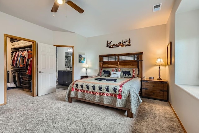 320 Kestrel Ln Unit 320, Silverthorne, CO 80498 - carpeted bedroom with a spacious closet, ensuite bathroom, a closet, ceiling fan, and baseboards