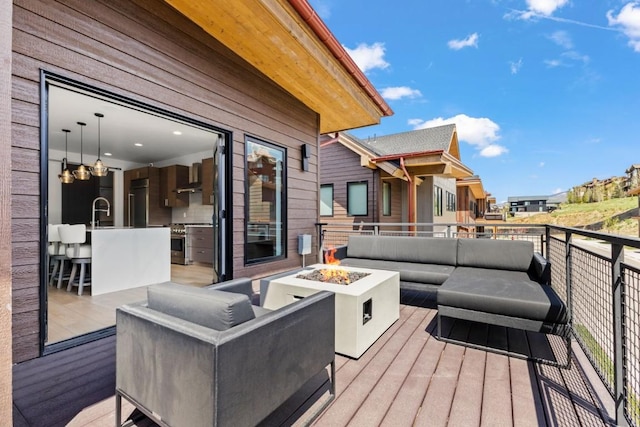 1241 Urban Way, Steamboat Springs, CO 80487 - deck featuring an outdoor living space with a fire pit