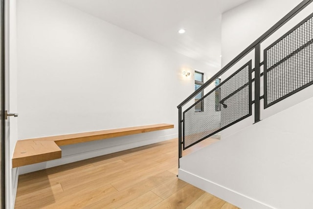 1241 Urban Way, Steamboat Springs, CO 80487 - stairs featuring wood finished floors, recessed lighting, and baseboards