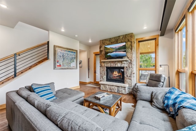 7 Moss Way, Silverthorne, CO 80498 - living room featuring wood finished floors, recessed lighting, a fireplace, and stairs