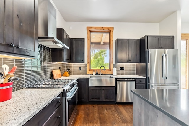 7 Moss Way, Silverthorne, CO 80498 - kitchen featuring stainless steel appliances, wall chimney exhaust hood, backsplash, and dark wood-type flooring