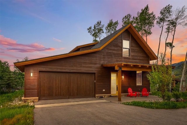 7 Moss Way, Silverthorne, CO 80498 - view of front facade featuring driveway and an attached garage