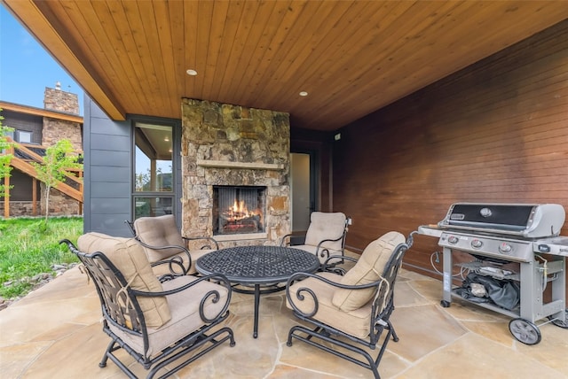 7 Moss Way, Silverthorne, CO 80498 - view of patio / terrace featuring an outdoor stone fireplace and area for grilling
