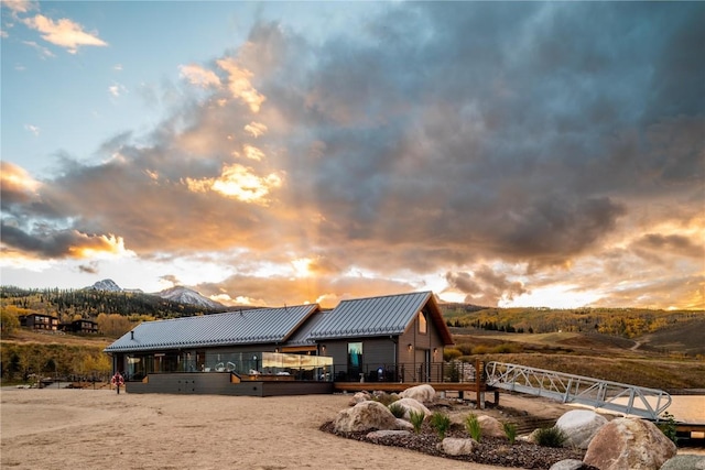7 Moss Way, Silverthorne, CO 80498 - rear view of property featuring a metal roof and a deck with mountain view
