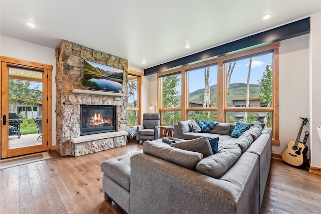 7 Moss Way, Silverthorne, CO 80498 - living room with hardwood / wood-style flooring, a fireplace, and recessed lighting