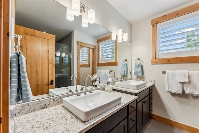 7 Moss Way, Silverthorne, CO 80498 - bathroom with double vanity, a stall shower, plenty of natural light, and tile patterned floors