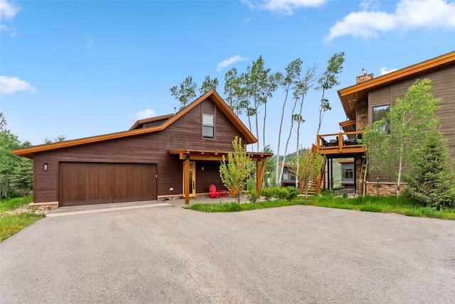 7 Moss Way, Silverthorne, CO 80498 - rustic home featuring asphalt driveway and a chimney
