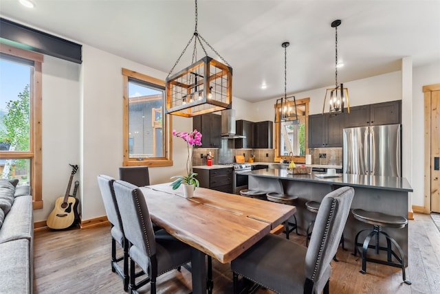7 Moss Way, Silverthorne, CO 80498 - dining area featuring light wood-type flooring and a chandelier
