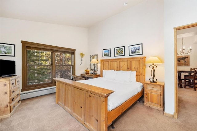 bedroom with baseboard heating, light carpet, and a notable chandelier