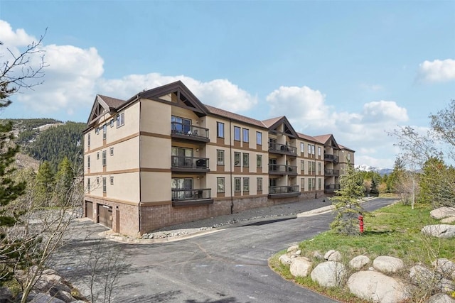 22787 US Highway 6 Unit 302, Keystone, CO 80435 - view of apartment building / complex with a garage