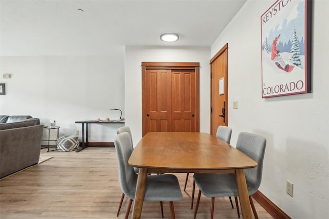 22787 US Highway 6 Unit 302, Keystone, CO 80435 - dining room featuring light wood-style floors and baseboards