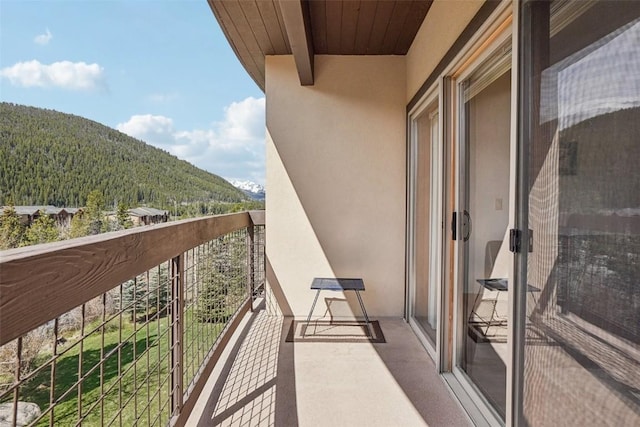 22787 US Highway 6 Unit 302, Keystone, CO 80435 - balcony featuring a mountain view and a wooded view
