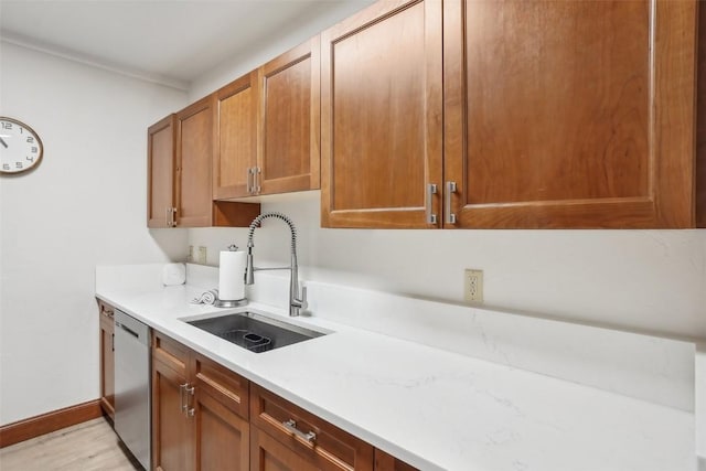22787 US Highway 6 Unit 302, Keystone, CO 80435 - kitchen with a sink, dishwasher, light countertops, light wood-style flooring, and baseboards