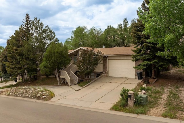951 Alta Vista Dr, Craig, CO 81625 - view of property hidden behind natural elements with a garage and concrete driveway
