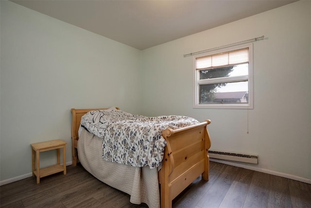 951 Alta Vista Dr, Craig, CO 81625 - bedroom featuring a baseboard radiator, wood finished floors, and baseboards
