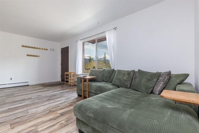 180 Evergreen Rd Unit 105, Dillon, CO 80435 - living area with a baseboard radiator and wood finished floors