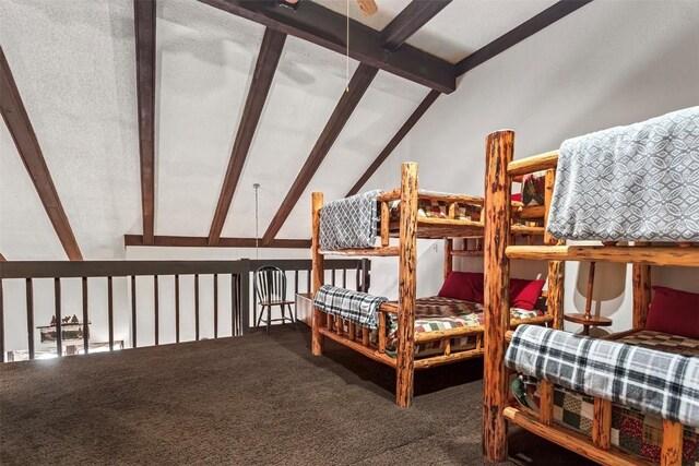 bedroom with carpet flooring and lofted ceiling with beams