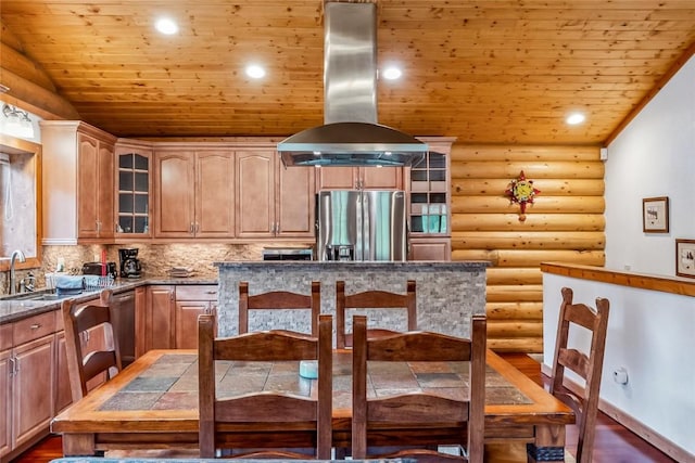 kitchen featuring appliances with stainless steel finishes, log walls, island exhaust hood, wooden ceiling, and a sink