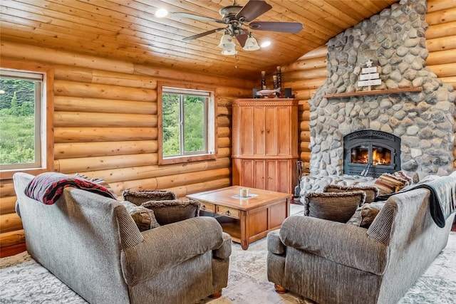 living room featuring log walls, a ceiling fan, wooden ceiling, a stone fireplace, and recessed lighting