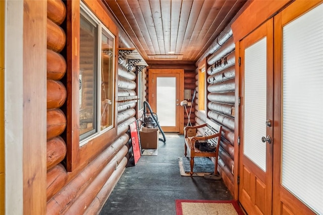 corridor with log walls and wooden ceiling