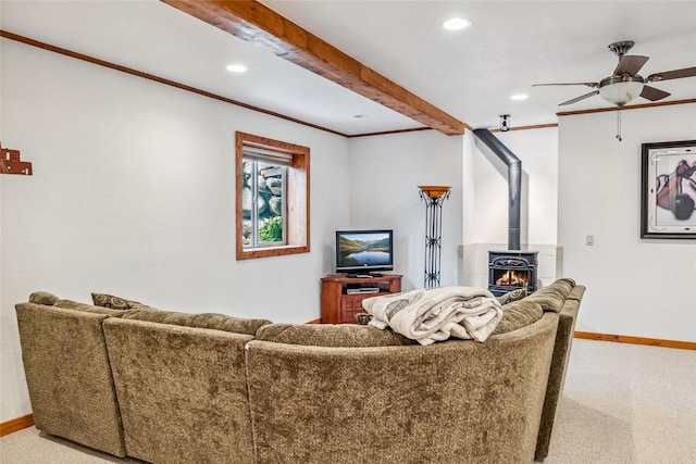 living area with carpet floors, ceiling fan, baseboards, recessed lighting, and ornamental molding