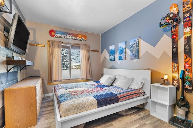 bedroom featuring wood finished floors
