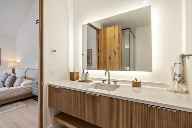214 Windflower Ln, Frisco, CO 80443 - full bath with ensuite bathroom, vanity, and wood finished floors