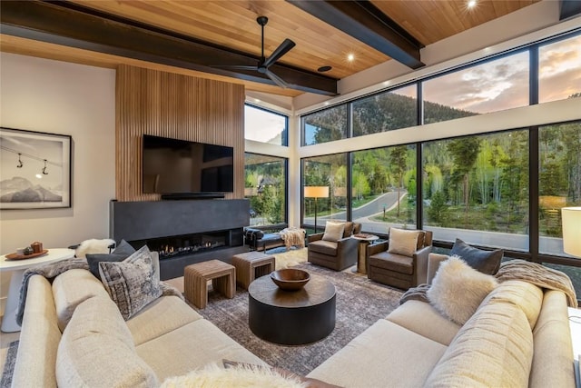 214 Windflower Ln, Frisco, CO 80443 - living room with wooden ceiling with exposed beams and ceiling fan