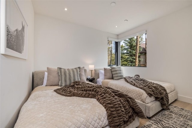 214 Windflower Ln, Frisco, CO 80443 - bedroom featuring wood finished floors, recessed lighting, and baseboards