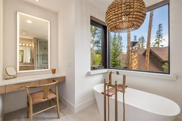 214 Windflower Ln, Frisco, CO 80443 - bathroom featuring baseboards, a soaking tub, and recessed lighting