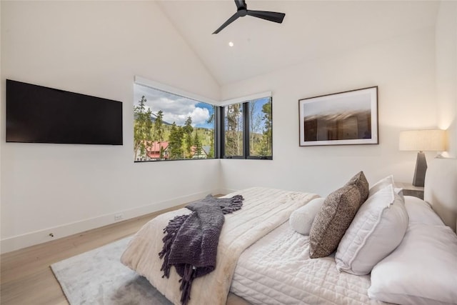 214 Windflower Ln, Frisco, CO 80443 - bedroom featuring wood finished floors, baseboards, a ceiling fan, recessed lighting, and high vaulted ceiling