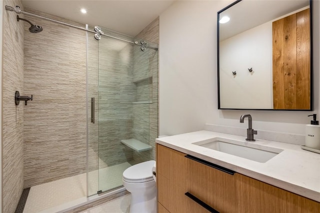 214 Windflower Ln, Frisco, CO 80443 - bathroom with toilet, vanity, a shower stall, and recessed lighting