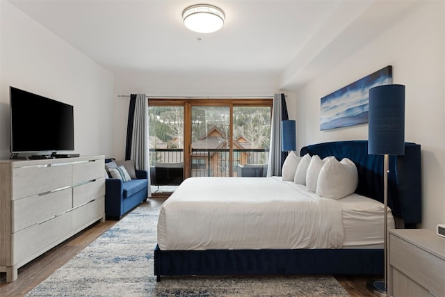 23110 US Highway 6 Unit 5074, Keystone, CO 80435 - bedroom featuring wood finished floors and access to exterior